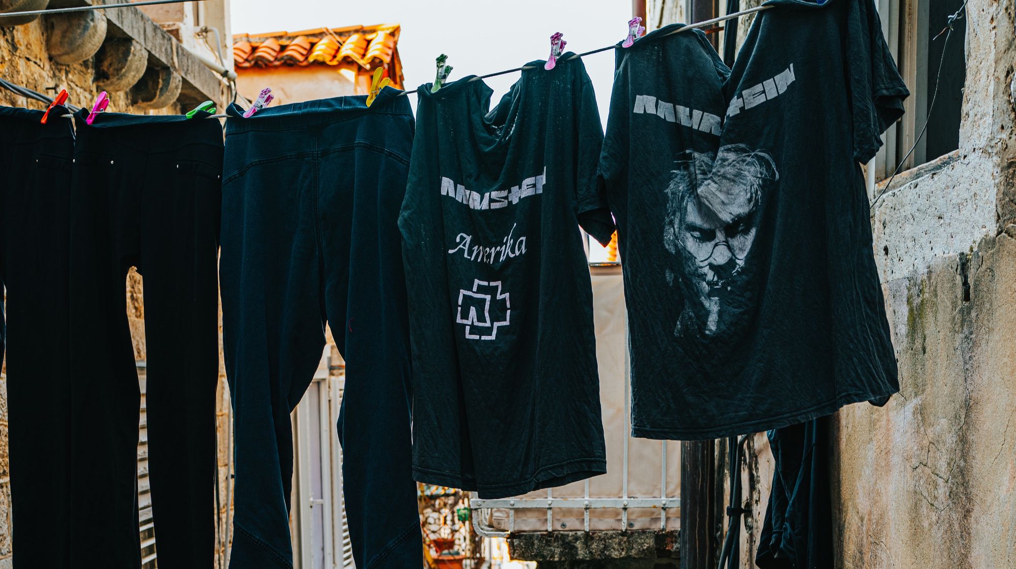 Two Rammstein t-shirts hanging to dry